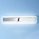 Antille LED-Wandleuchte Large an einer blauen Wand mit modernem Design und sanfter Beleuchtung.
