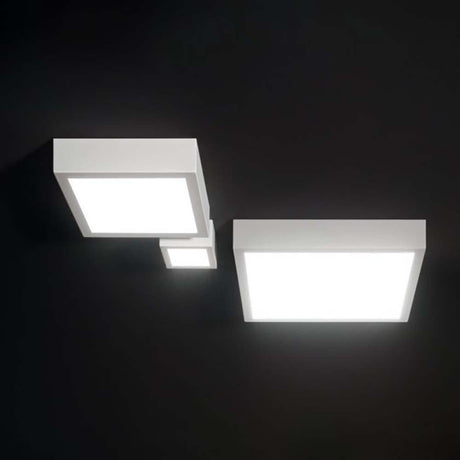 Box SQ LED XL ceiling light in three different sizes with sandblasted diffuser on a black background.