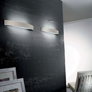 Curvè LED wall light Large on a stylish wall with a modern design.
