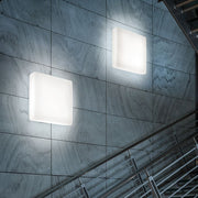 MyWhite Full light Q LED ceiling light on a modern wall in the stairwell.