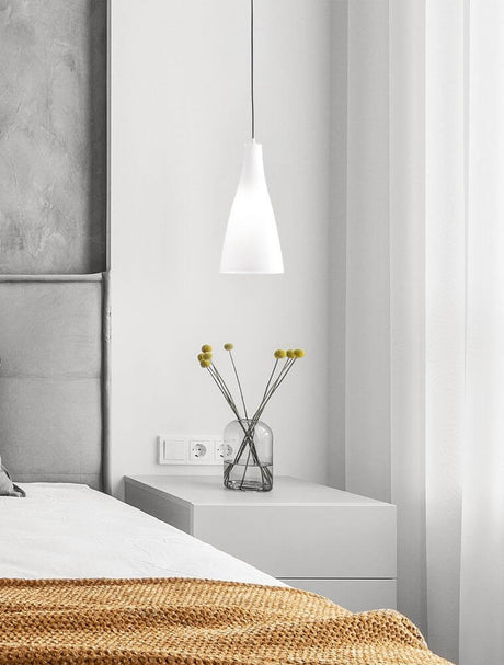 Livtar pendant light E27 Ø 23cm above a bedside table in a modern bedroom with white curtains.