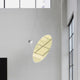 Luceplan Amisol Reflektorplatten in einem modernen Raum, oval mit metallisierter Oberfläche und LED-Beleuchtung.
