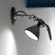 Luceplan Fortebraccio Wand- & Deckenspot Ø 16cm mit verstellbarem Arm und modernem Design.