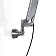 Fixation murale Luceplan Fortebraccio Ø 23,6 cm en métal avec articulation centrale pour des mouvements flexibles.