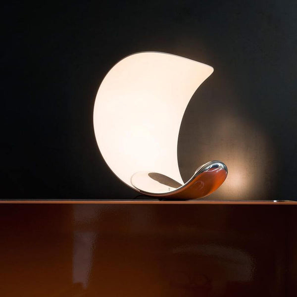 Luceplan LED Curl dimmable table lamp with an elegant, playful design and dimmable light temperature.