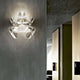Luceplan Wandlampe Hope Ø 48cm transparent an einer modernen Wand in einem eleganten Raum.