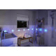 Moderne Badezimmer mit LumiTiles LED Fliesen in Blau, entspannende Atmosphäre mit Badewanne und Handtüchern.
