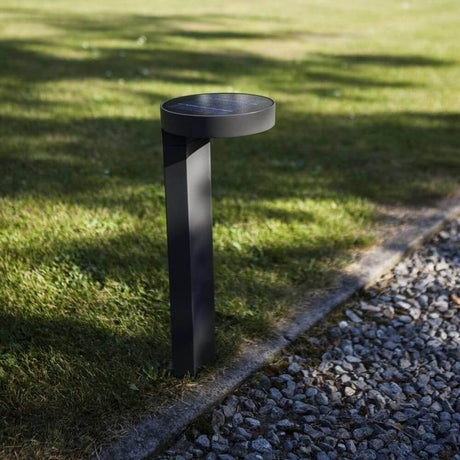 LED Diso solar bollard light IP44 anthracite on lawn with solar module, elegant and modern.