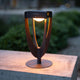 Solar path light Tulip black with LED lighting, height-adjustable 47cm, front view at dusk