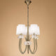 6-flammige Pendelleuchte Loewe schmal in modernem Design mit Metall und Glas.