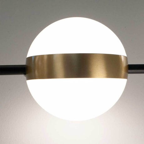 Cuba LED-pendant light line with a round shape, gold and black color scheme.