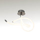LED-Deckenlampe Armonia Curl mit geschwungener Form und eleganter Lichtwirkung.