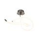 LED-Deckenlampe Armonia Curl mit geschwungener Form und eleganter Lichtwirkung.