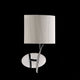 Eve Wandlampe mit elegantem Design und hochwertiger Verarbeitung in runder Form auf schwarzem Hintergrund.