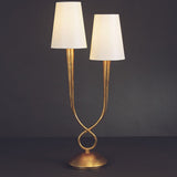 Tischlampe Paola mit zwei weißen Lampenschirmen und goldenem Gestell, ideal für moderne Wohnräume.