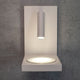 Zanzibar LED-Wandlampe mit Induktionsladegerät für Handy an einer Wand angebracht, modernes Lichtdesign.
