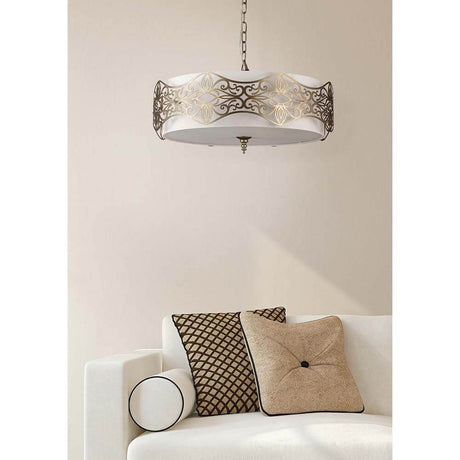 Burgeon Pendelleuchte Bronze über einem Sofa mit dekorativen Kissen im eleganten Wohnambiente.