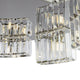 Colline Glas-Pendelleuchte im Asymmetrischen Design mit glanzpolierten Glaselementen und harmonischer Kolonnade.