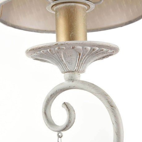 Detailed view of the Enna wall light with a curved metal frame and decorative PVC lampshade.