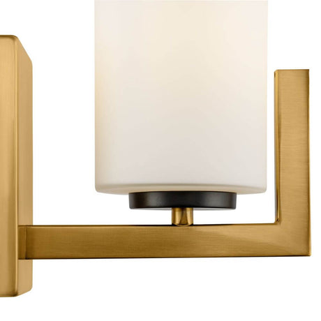 Fortano Wandleuchte mit zylindrischem Glaslampenschirm und Messing-Farbton Metallbeschlägen.