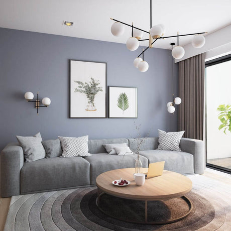 Nostalgia pendant light Big in a modern living room with a grey sofa and round coffee table.