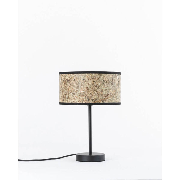 Stylish metal table lamp with hay lampshade, elegant design for a cozy living atmosphere.