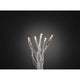 Micro LED Lichterkette 100 Warmweiße Dioden auf transparentem Kabel leuchtend vor dunklem Hintergrund.