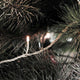 Micro LED Lichterkette 40 Warmweiße Dioden IP44 an einem Weihnachtsbaum, beleuchtet und festlich dekoriert.