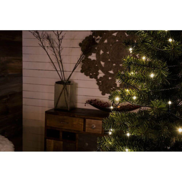 Close-up of a 12m Micro LED frosted string lights 10 warm white diodes on a Christmas tree