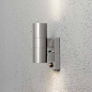 Modena outdoor wall light with motion sensor made of stainless steel mounted on a wall in modern design.