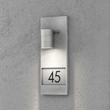 Lámpara de pared exterior Modena con números de casa galvanizados 