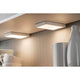Möbel Aufbauleuchte LED Vane eckig 2er-Set LED-Modul 2x6, 7W unter einem Regal, strahlendes Warmweiß.