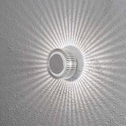 Monza LED effect outdoor wall light, solid aluminium on a wall with light effects.
