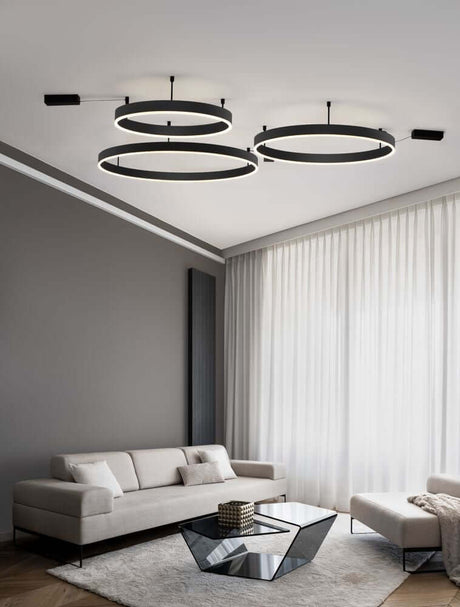 Plafonnier Motif LED Ø 100cm 3000K dans un salon moderne avec un aménagement élégant.