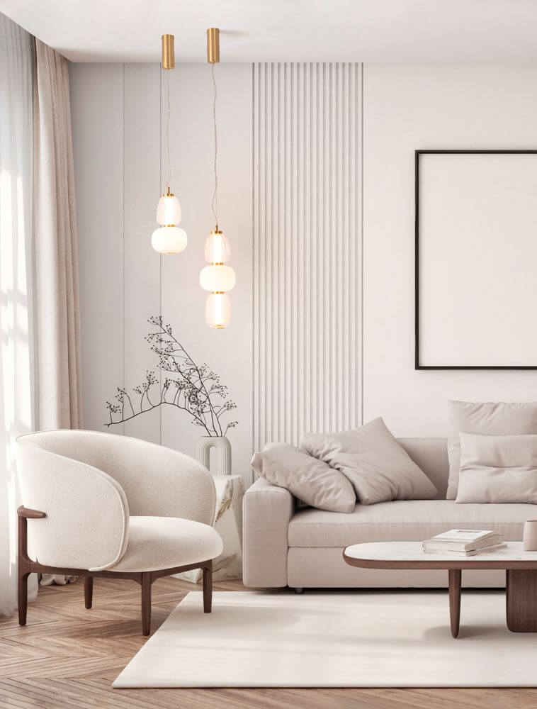 Moderne Wohnatmosphäre mit Movil Pendelleuchte 3-flammig Ø 17cm 3000K Gold über elegantem Sofa.