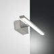 Nala LED Wandleuchte IP44 540lm Verchromt an einer Wand montiert, elegant und modern.