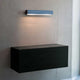 Nemo Applique Cylindrique Lounge Wandlampe 48cm in hellblauem Metall an der Wand montiert.