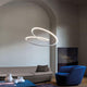 Nemo Kepler Up LED Pendelleuchte Ø 110cm in modernem Wohnraum über gemütlichem Sofa und blauem Sessel.
