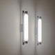 Zwei Nemo La Roche LED Wandlampen an der Wand mit sanftem Licht.