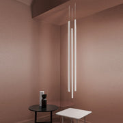 Nemo Linescapes Vertical LED pendant lamp 115 cm in modern room design with elegant furniture.