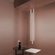 Nemo Linescapes Vertical LED Hängelampe 115cm in modernem Raumdesign mit eleganten Möbeln.