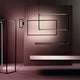 Nemo Spigolo Horizontal LED Hängeleuchte drehbar in modernem Innenraum mit eleganten, kreativen Lichtinstallationen.