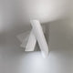 Nemo Tubes Large LED Wandlampe einstellbar in modernem Design an einer Wand montiert.