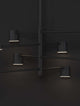 Nordik LED Pendelleuchte 8-flammig Ø 100cm 3000K Schwarz an schwarzer Wand, modernes Design mit warmweißem Licht.
