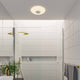 Djay Smart LED Deckenleuchte RGB in modernem Badezimmer-Design, kombiniert Licht und Bluetooth-Sound.