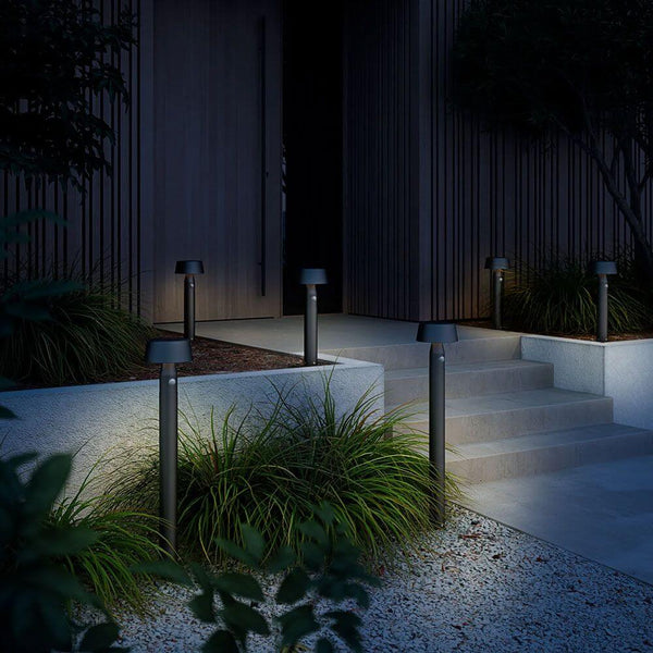 Solar LED path light Nama with motion sensor IP54 along a stylish entrance path at night.