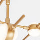Detailansicht der Atomo LED Metall Deckenbeleuchtung Gold mit elegantem Design und runden LED-Lampen.