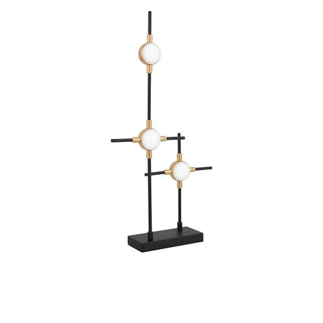 Lampe de table Atomo LED au design moderne avec d’élégants éléments en métal et en acrylique sur un socle noir.