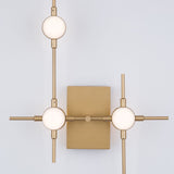 Moderne Atomo LED Wandleuchte in Gold mit sanften Acryl-Lichtern, ideal für Esszimmer und Wohnräume.