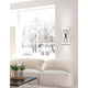 Boccale Glas-Wandlampe Chrom, Klar an einer Wand neben einem gemütlichen Sofa mit Winterblick.